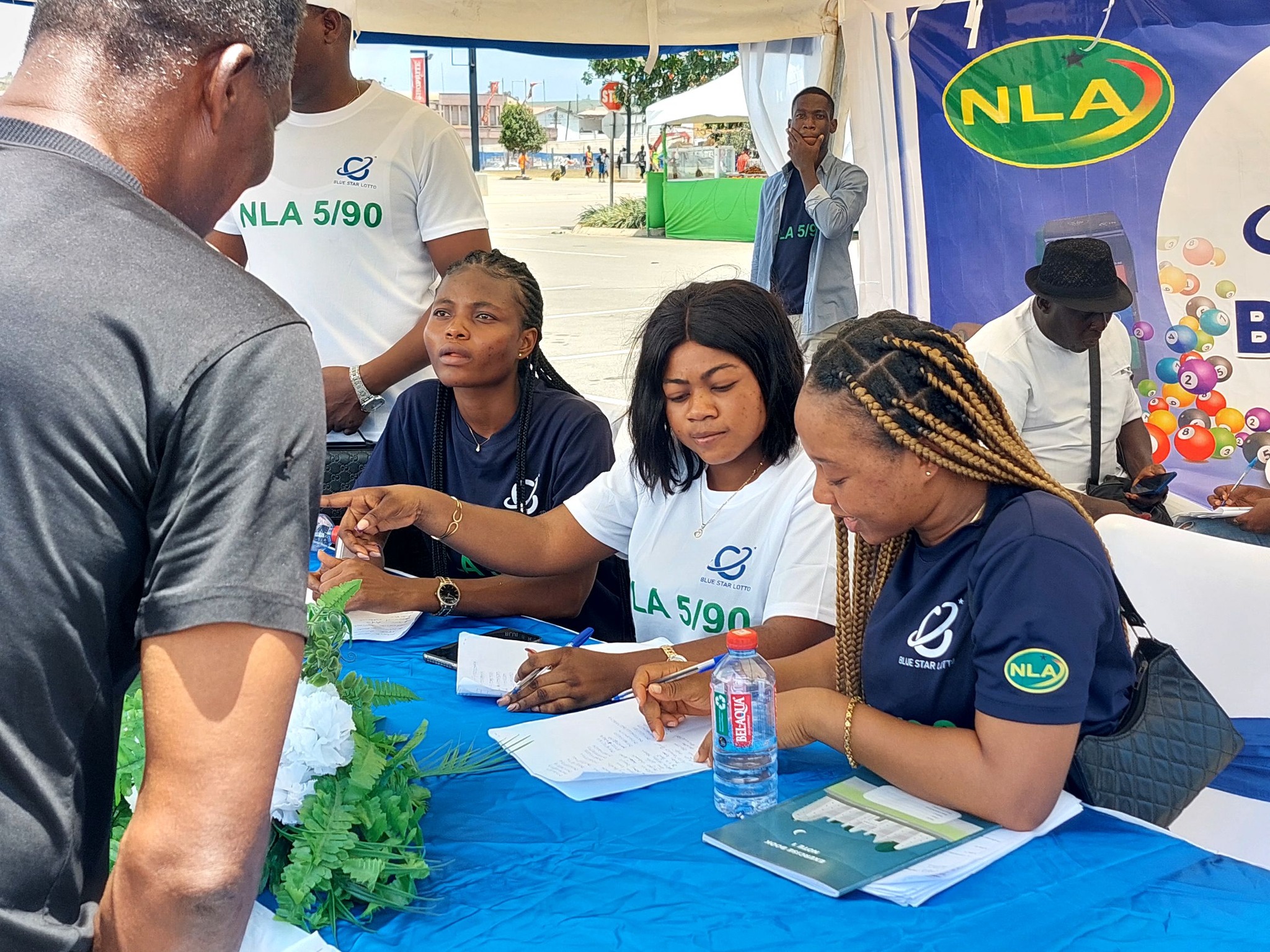 Blue Star Lotto App Launch – Guests interacting with the app